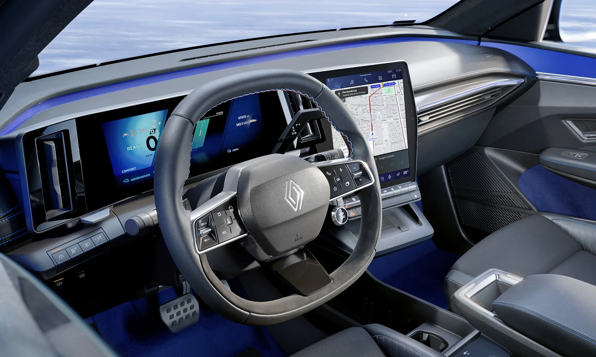 Interior de un Renault con botones físicos en el volante y el salpicadero